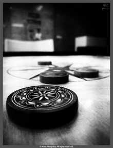 The Striker and the pieces on a carom board