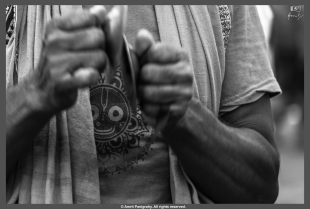 Lord Jagannath on a devotee’s t-shirt as he plays his Gini (a traditional Odia music instrument).